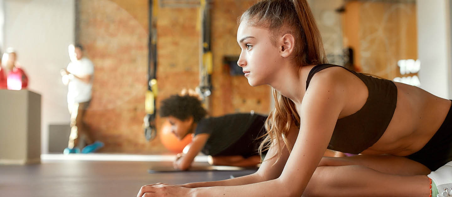 School aged female exercising