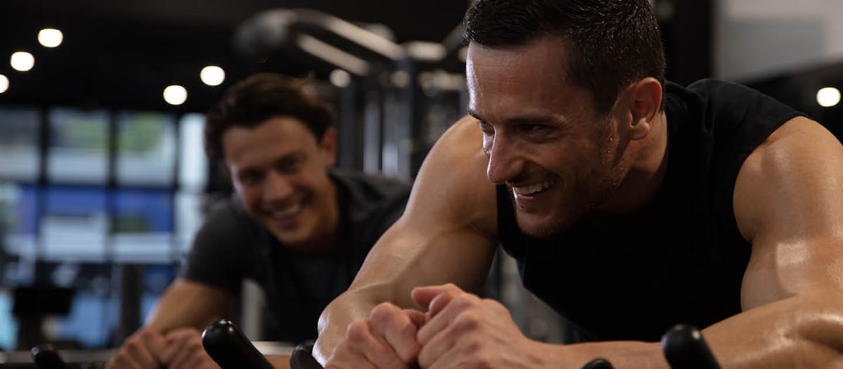 Male smiling while riding an electric bike
