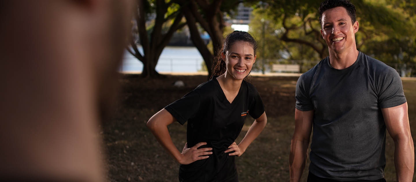 Male and female laughing after training session