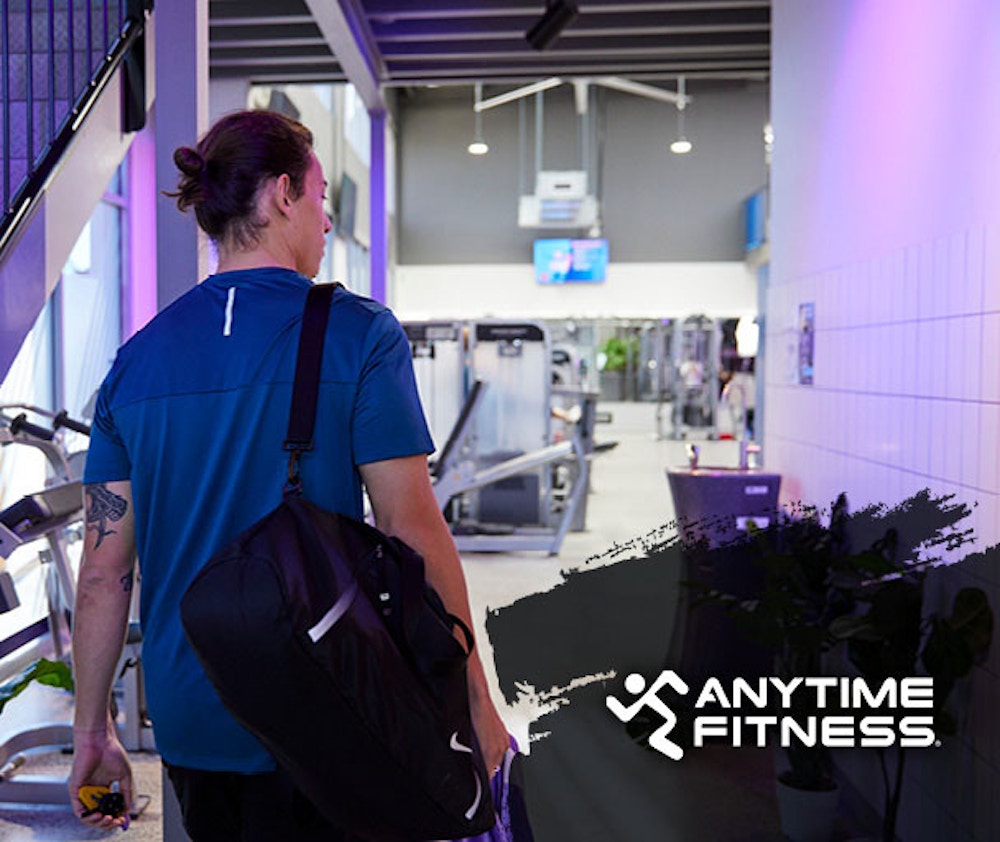 male walking into a gym