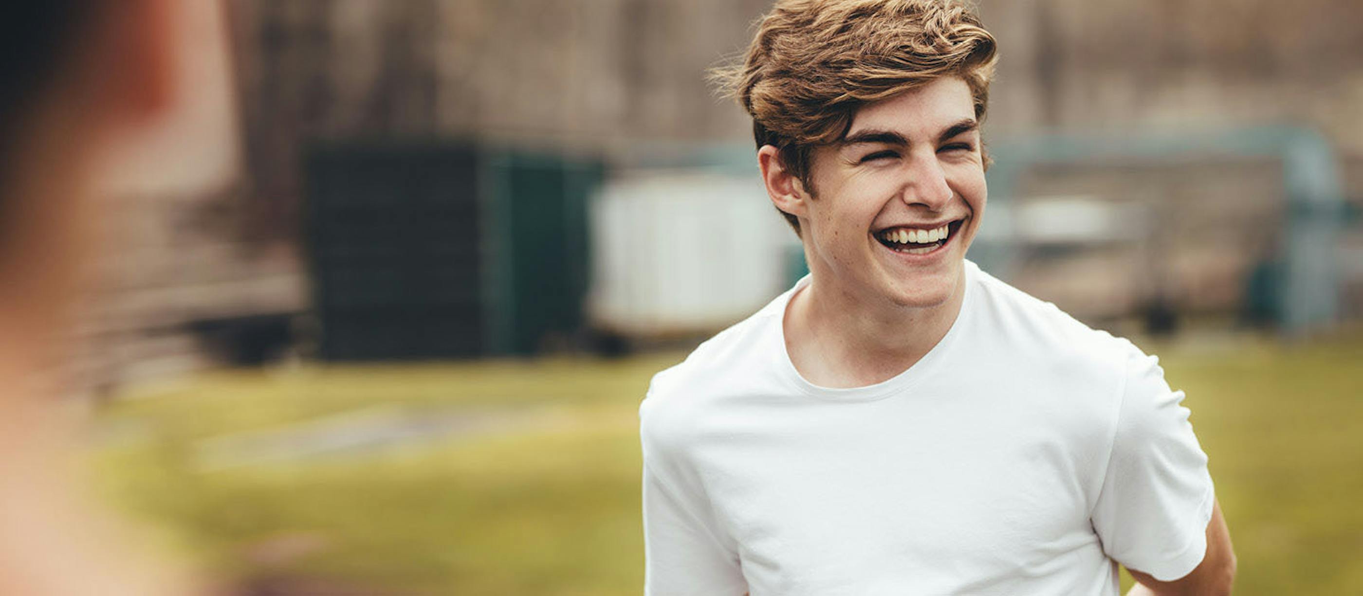 School aged male laughing