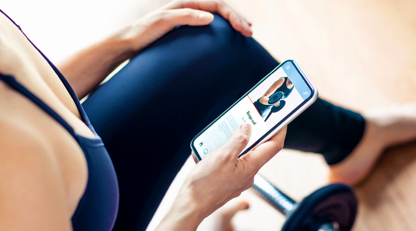 Woman using a training app on phone