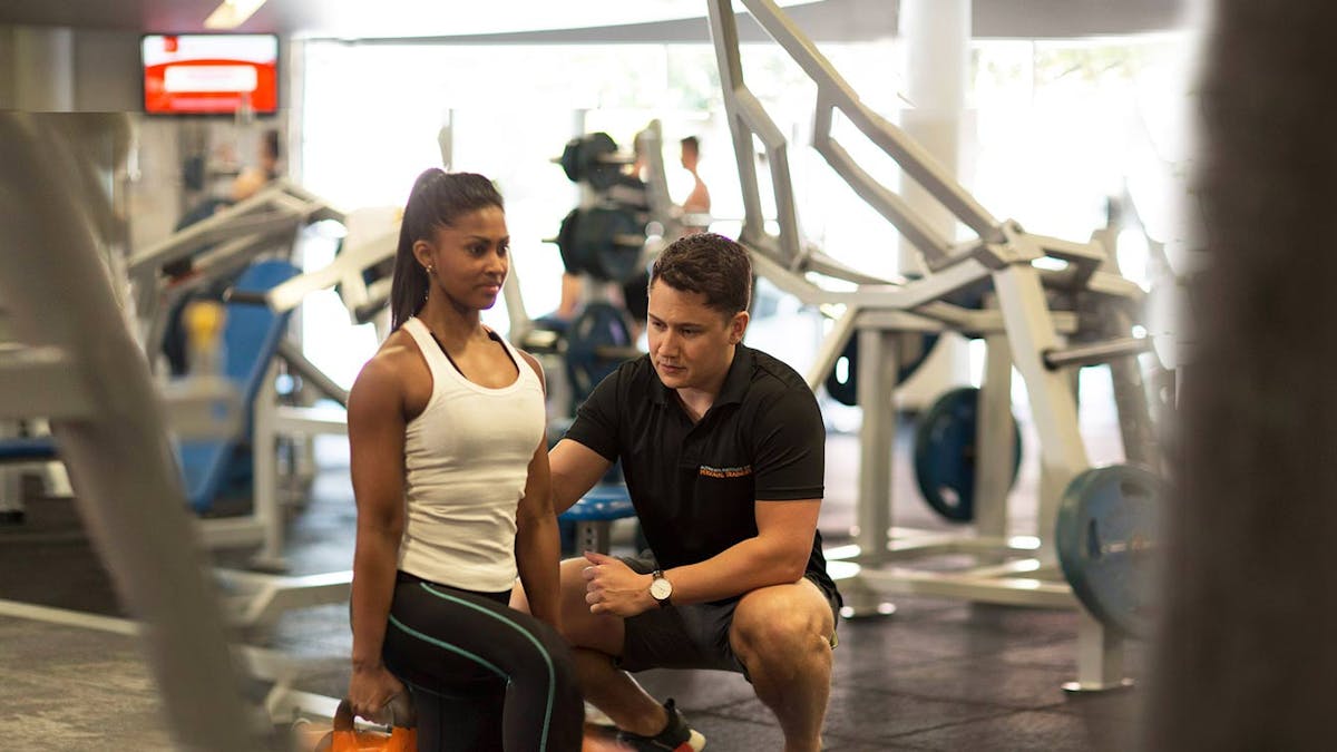 susie studying complete personal trainer in gym