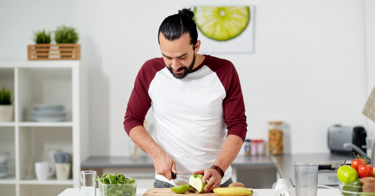 Man cutting fruit