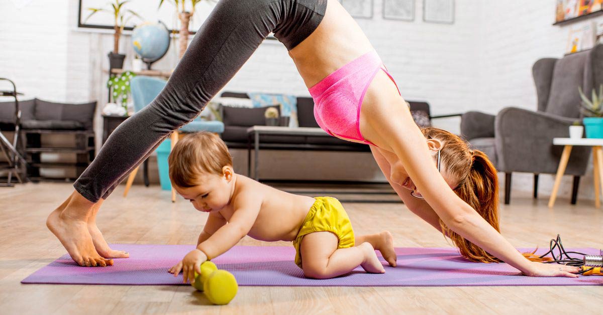 Mother working out near child