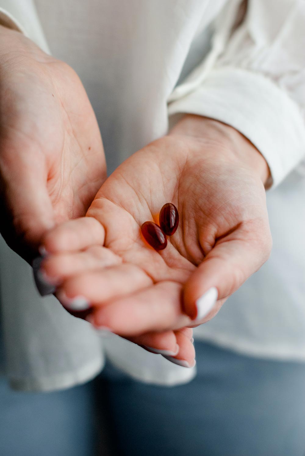 hand holding vitamins