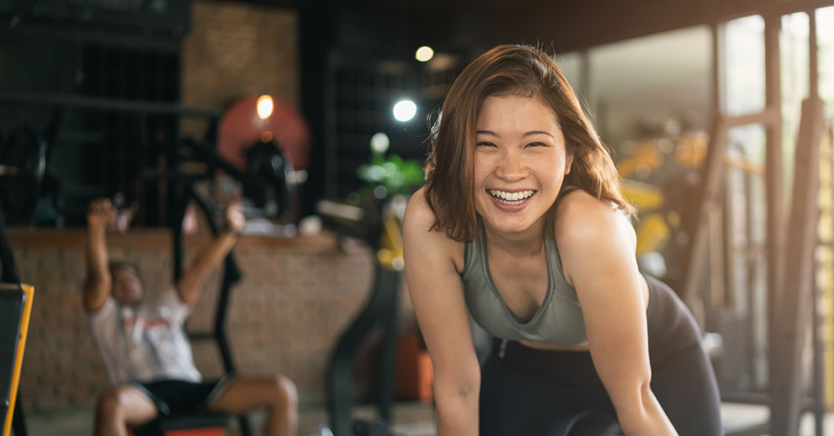 Smiling woman at the gym