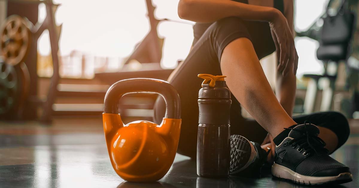 Fitness woman relaxing after exercise