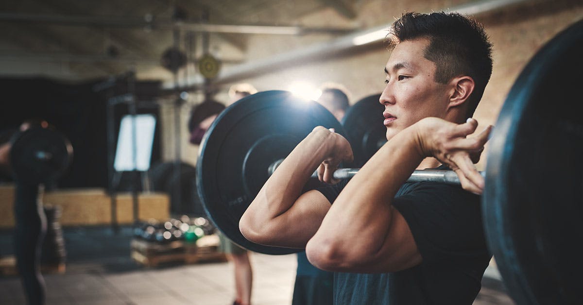 Man lifting barbells