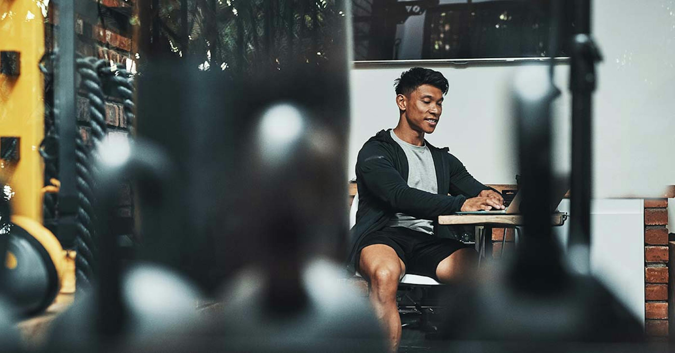 gym manager using a laptop