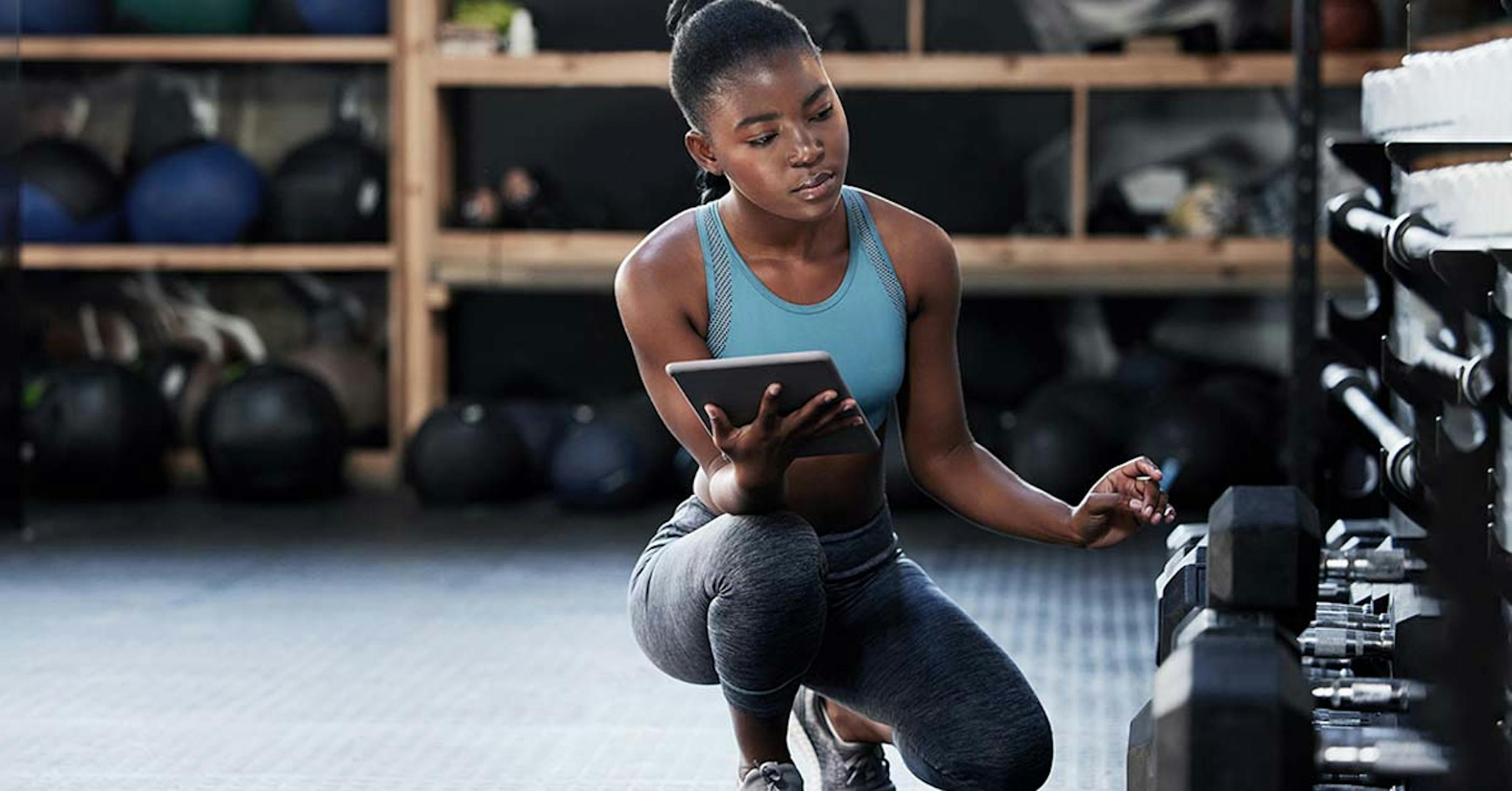 gym manager inspecting workout tools