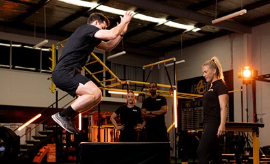 man doing box jump