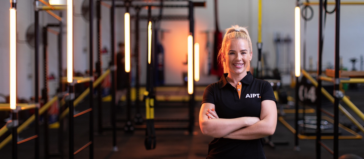 Woman smiling in a gym
