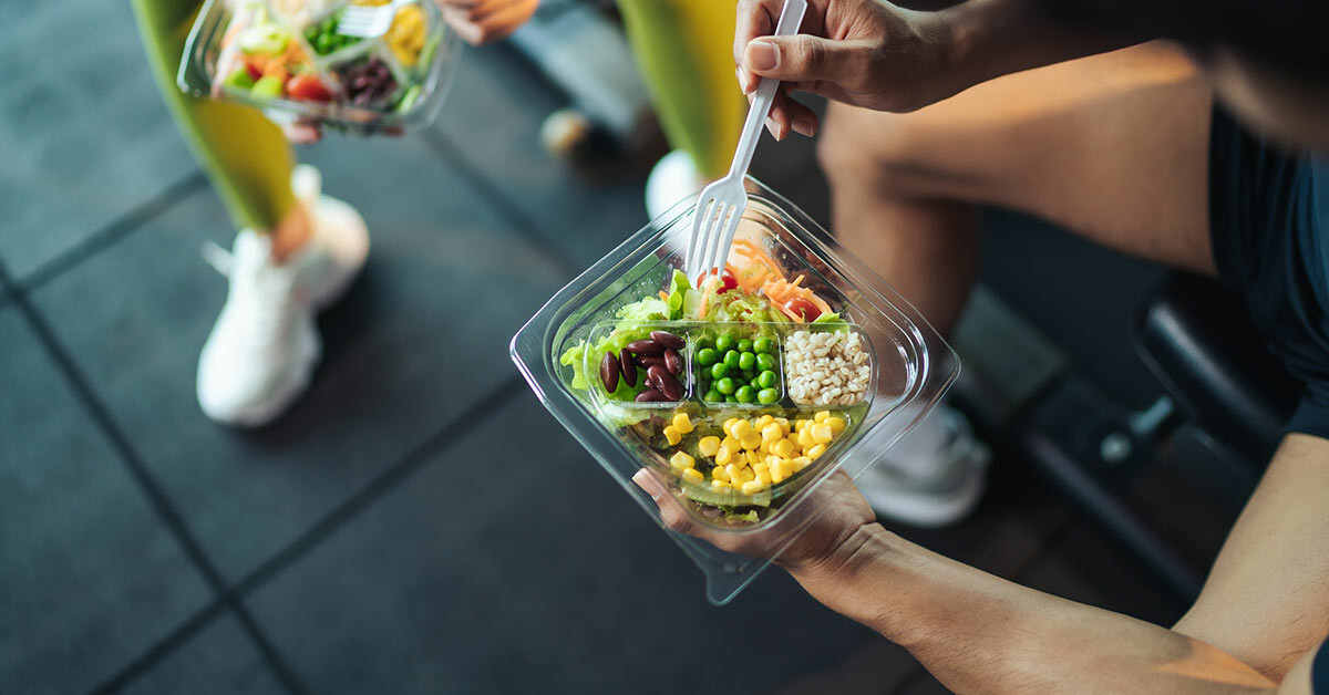 Person holding a healthy meal