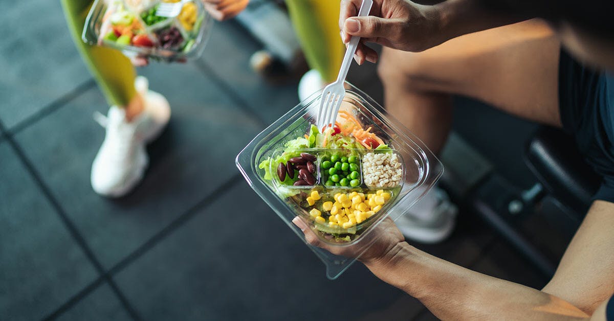 Person holding a healthy meal