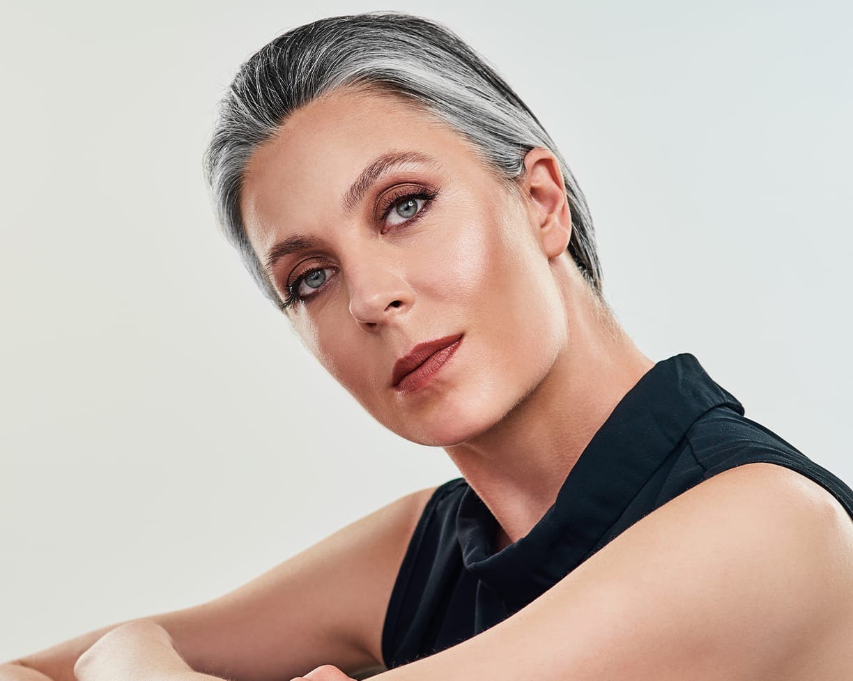 woman with grey hair pulled back