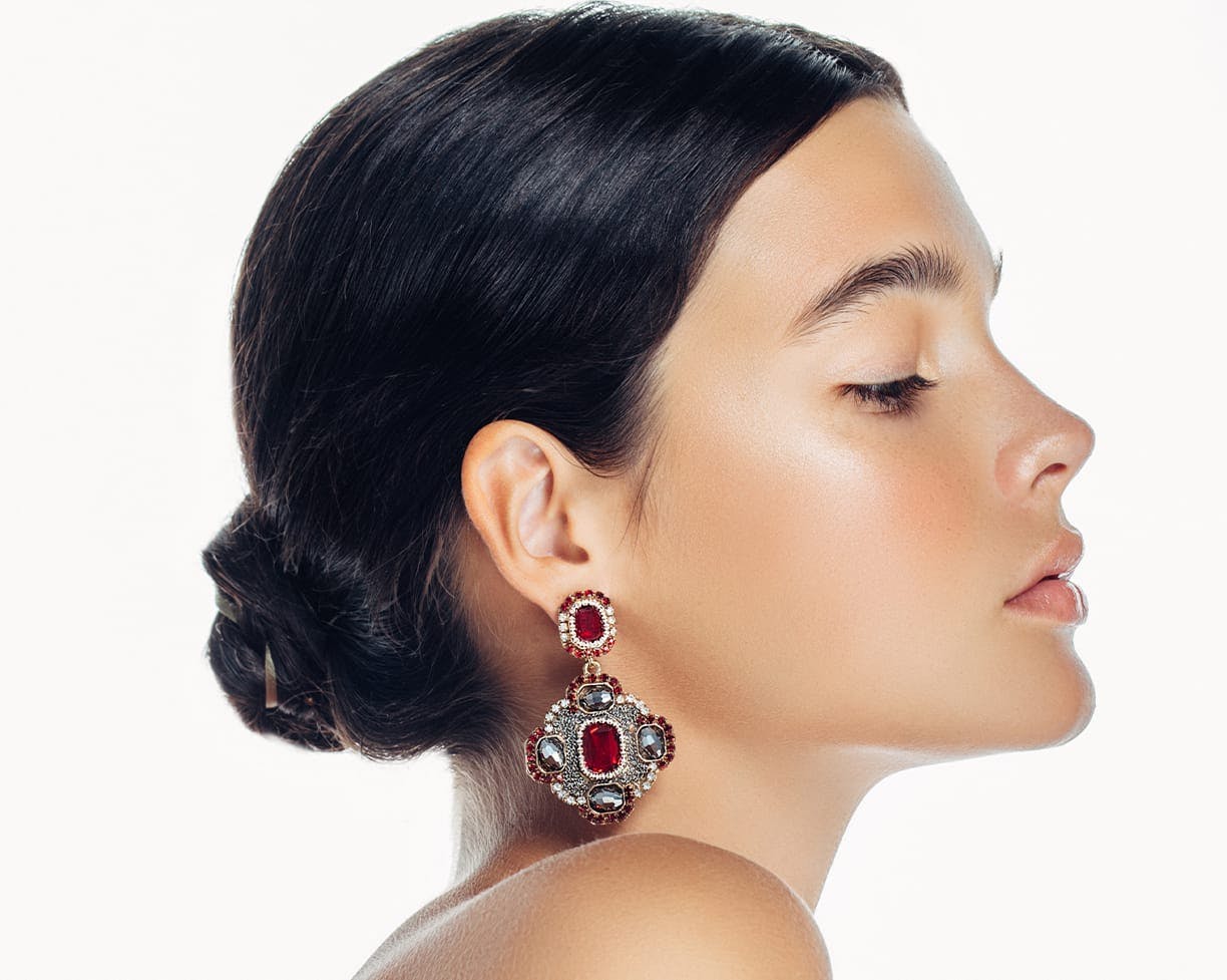 woman with bejeweled earrings
