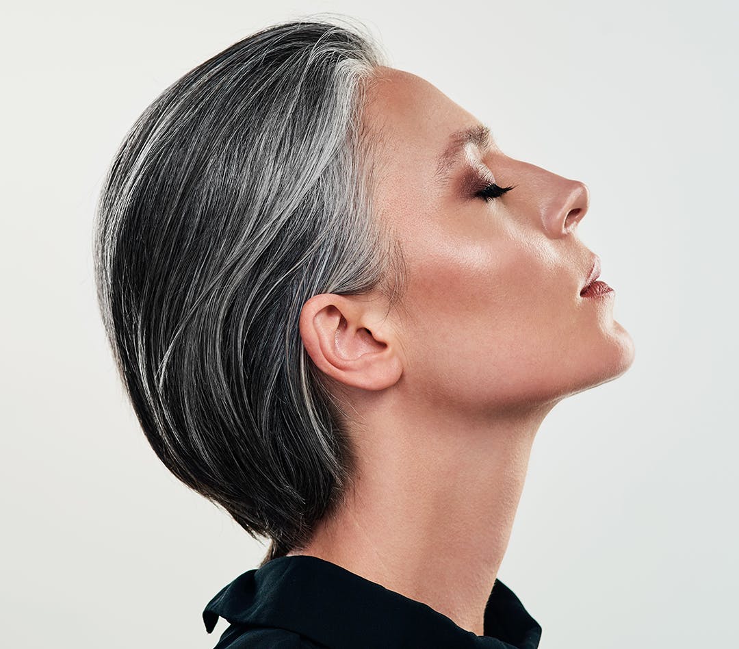 woman with head tilted back