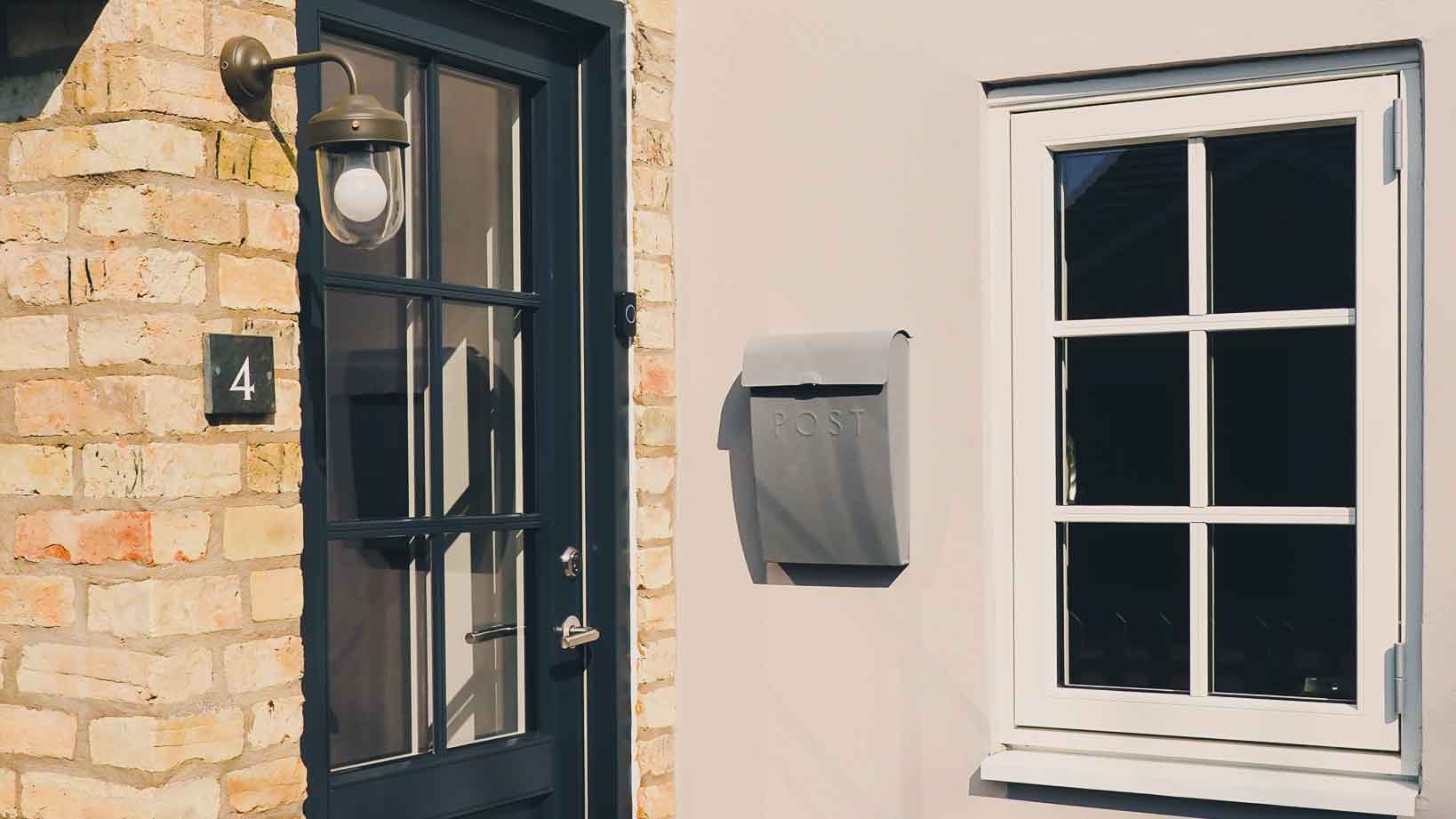 Black front door and Cottage Window on townhouse