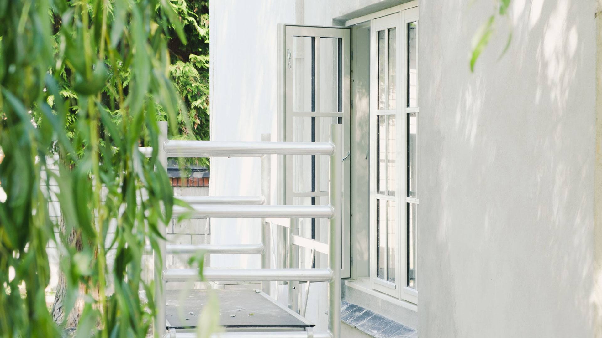 Cottage window with scaffolding in front