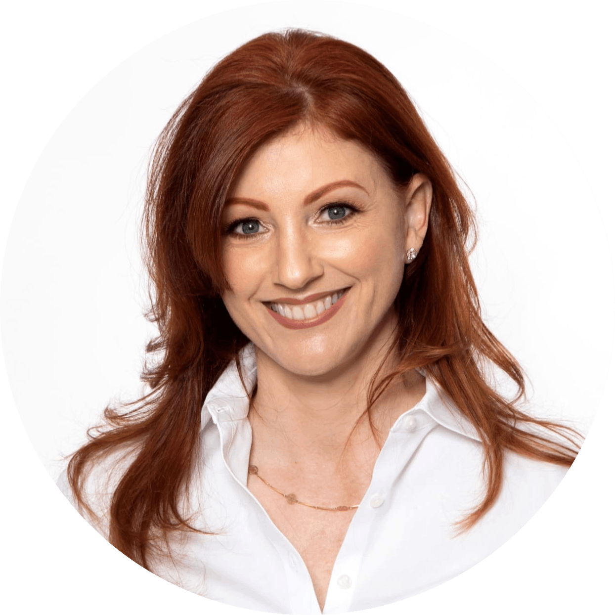 a redhaired model smiling in a white button down top