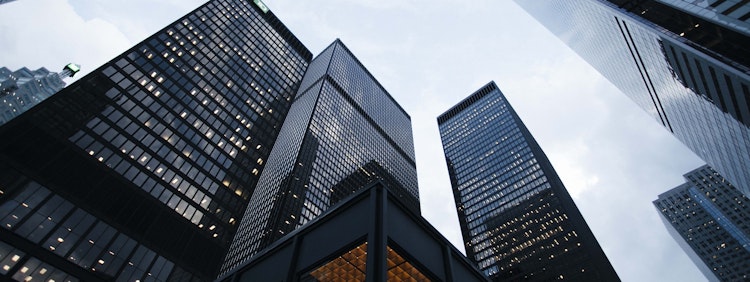 low angle photo of city high rise buildings during daytime