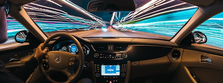 time lapse photography of man riding car