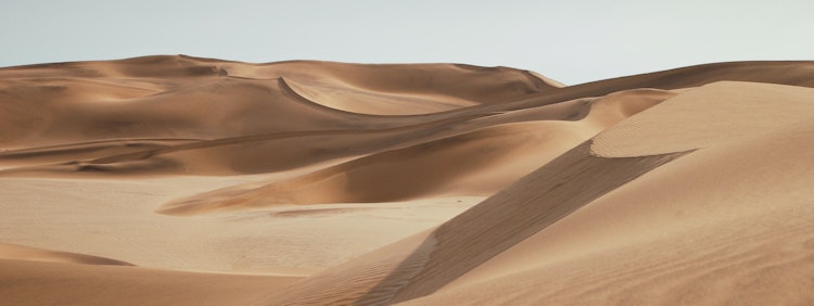 desert under clear blue sky during daytime