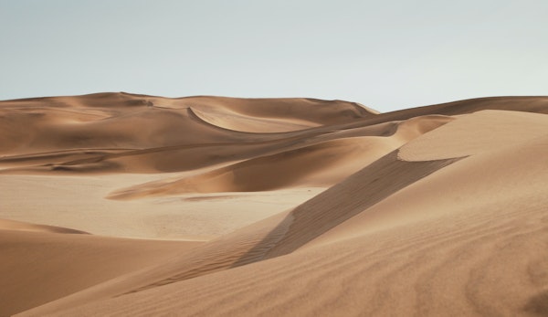 desert under clear blue sky during daytime