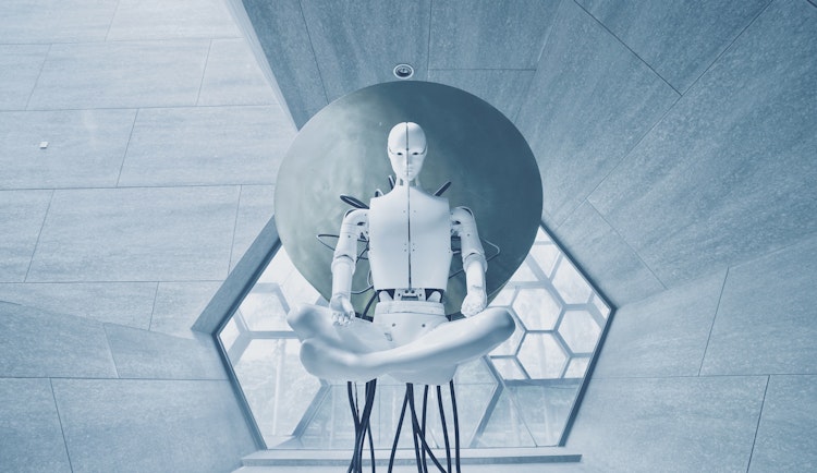 man in black jacket sitting on white chair