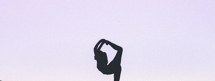 woman standing with her one leg