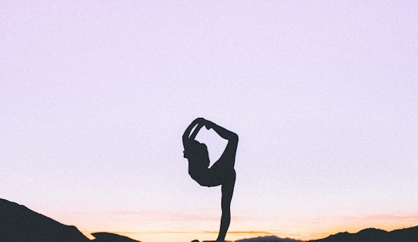 woman standing with her one leg