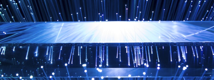 a large display of blue lights in a dark room