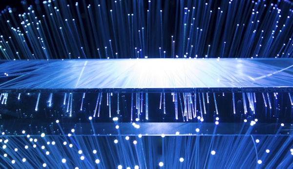 a large display of blue lights in a dark room