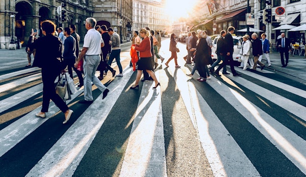 group of people walking on pedestrian lane