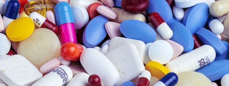 white blue and orange medication pill
