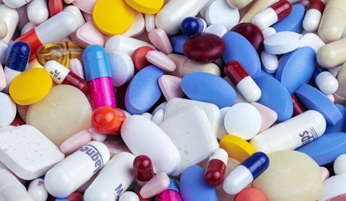 white blue and orange medication pill