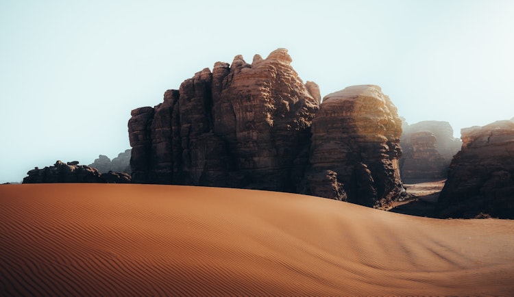 a desert landscape with rocks and sand