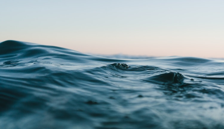 body of water under sky