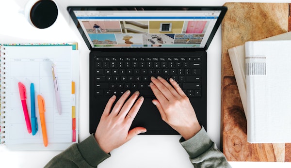 person using Microsoft Surface Laptop black laptop