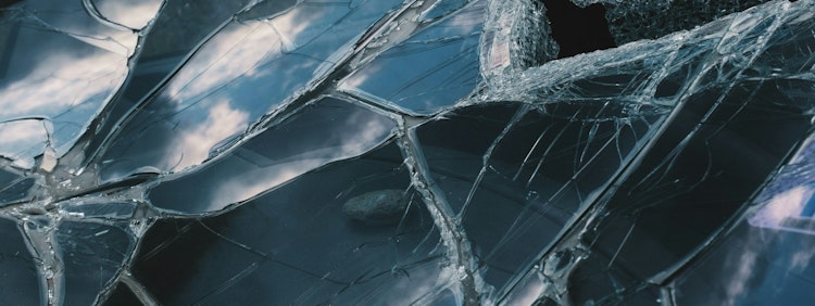 a close up of a broken glass window