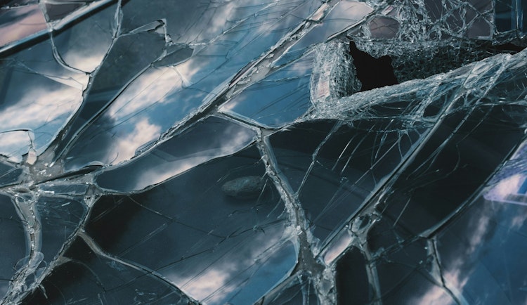 a close up of a broken glass window