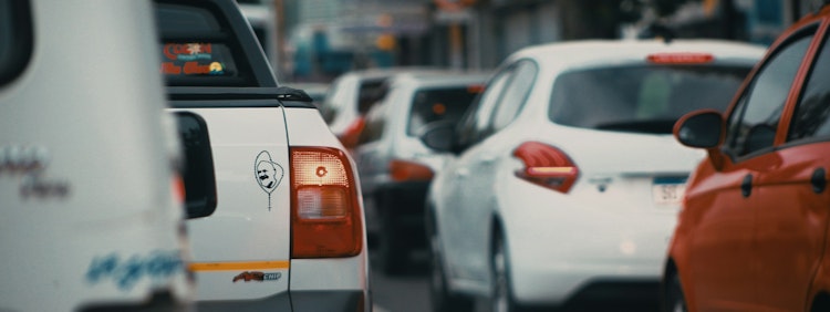 white and orange car on road during daytime