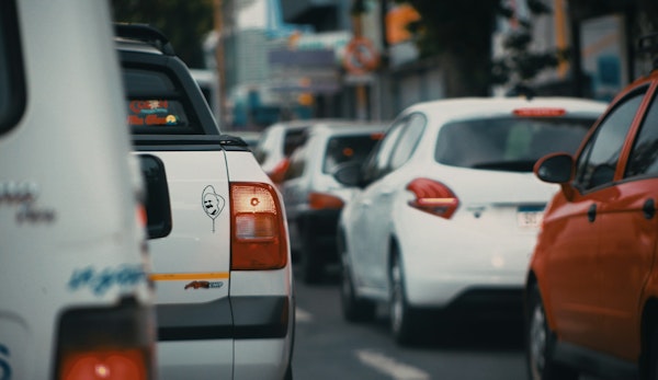 white and orange car on road during daytime