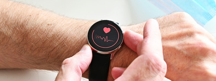 a person holding a stopwatch