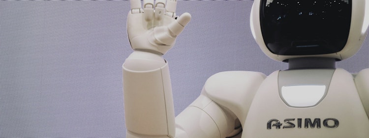 Asimo robot doing handsign