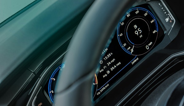gray car steering wheel and instrument panel cluster