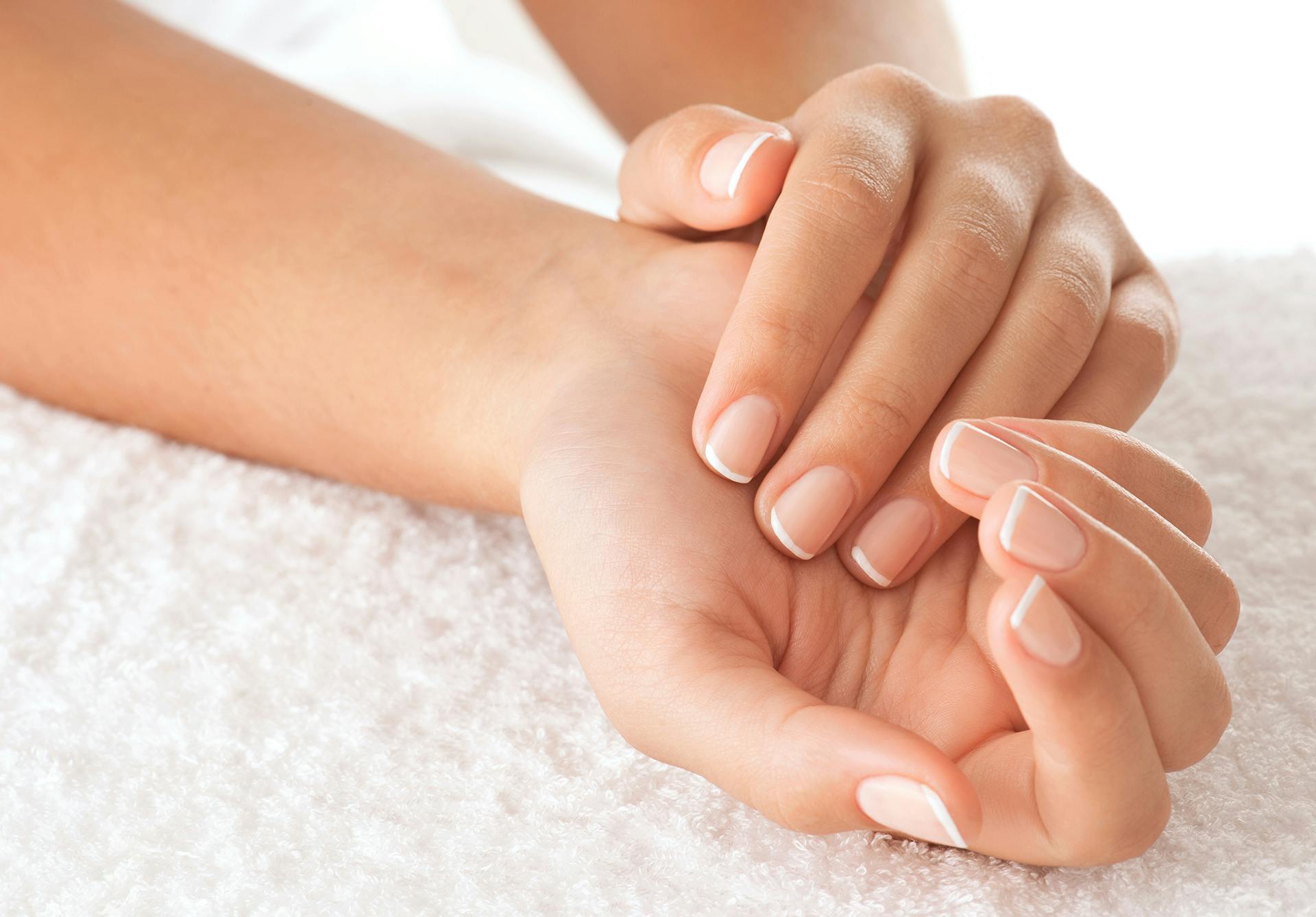 women's hands holding each other
