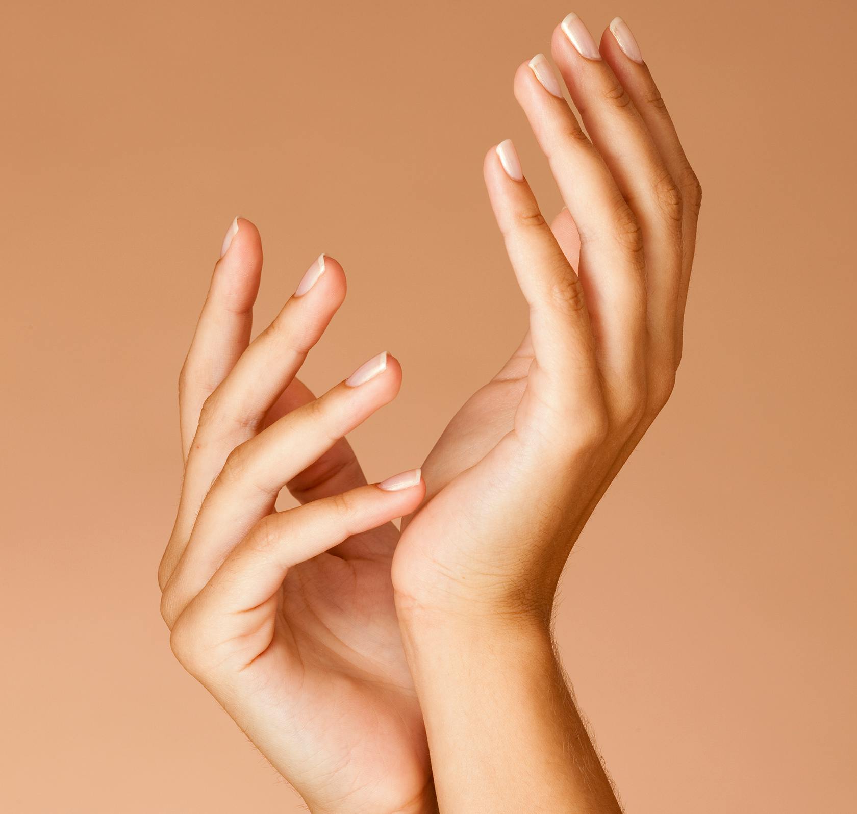 someone is holding their hands up in the air