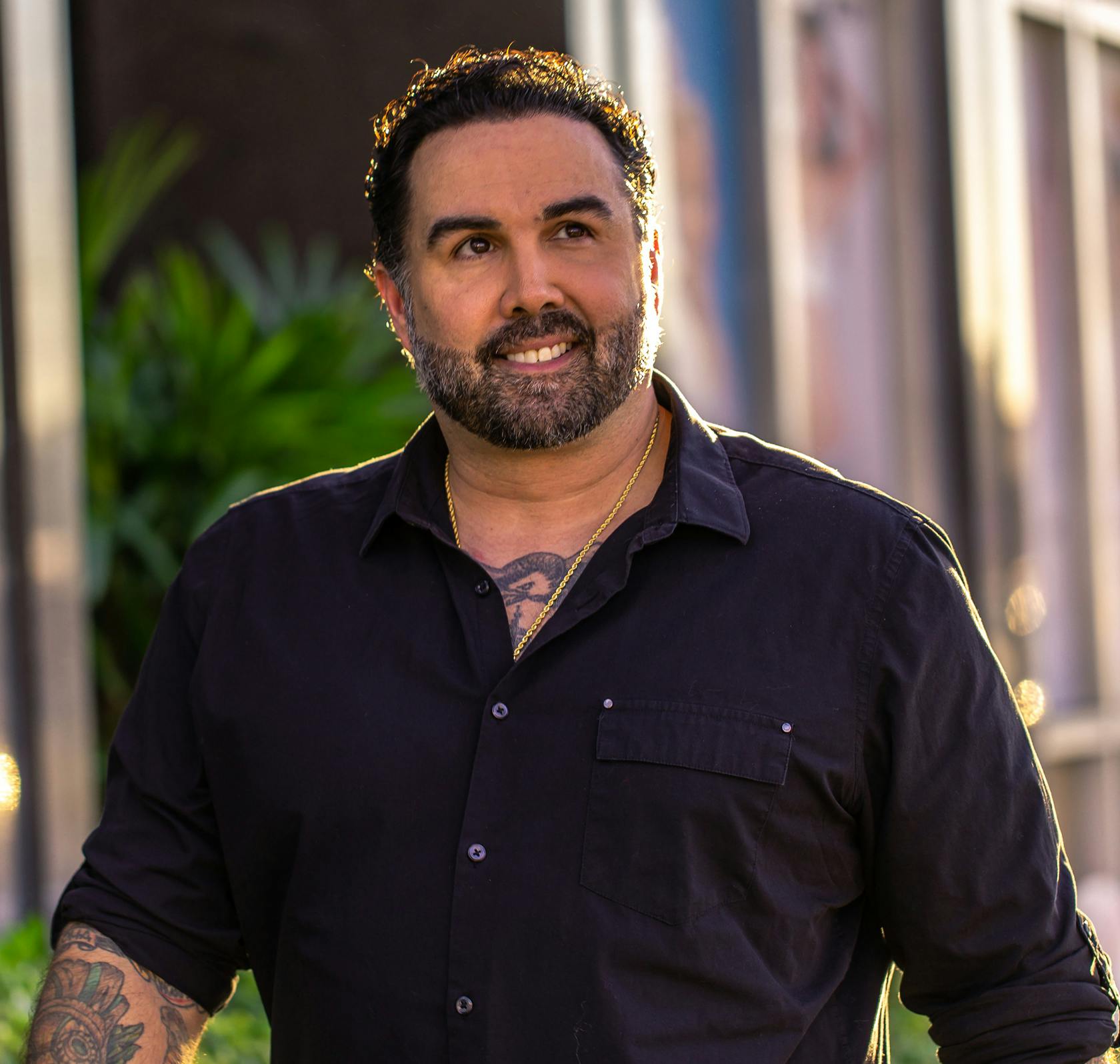 Man in a black button up shirt